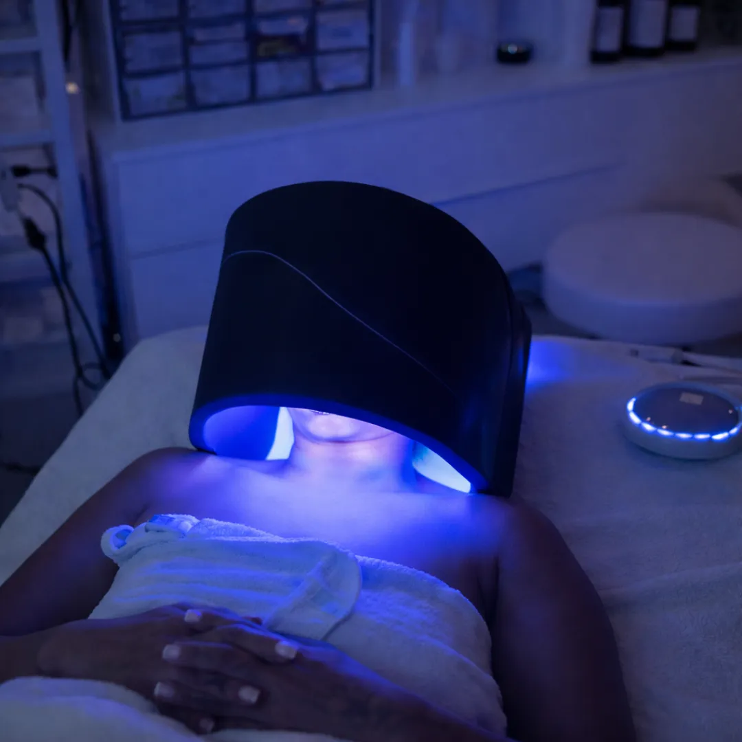 client receiving light therapy facial philadelphia
